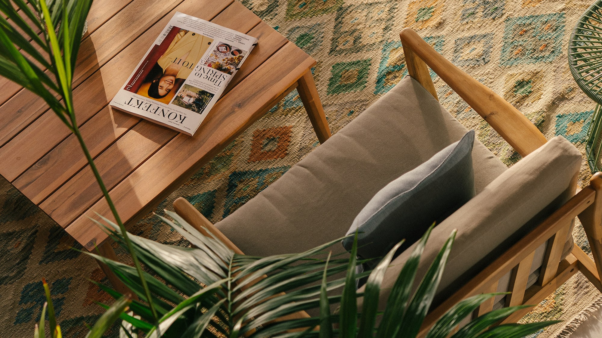 a chair and table with a book on it