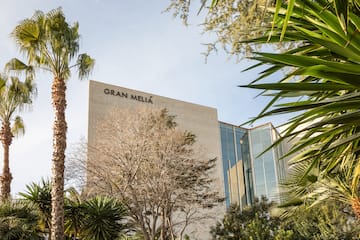 a building with trees and plants around it