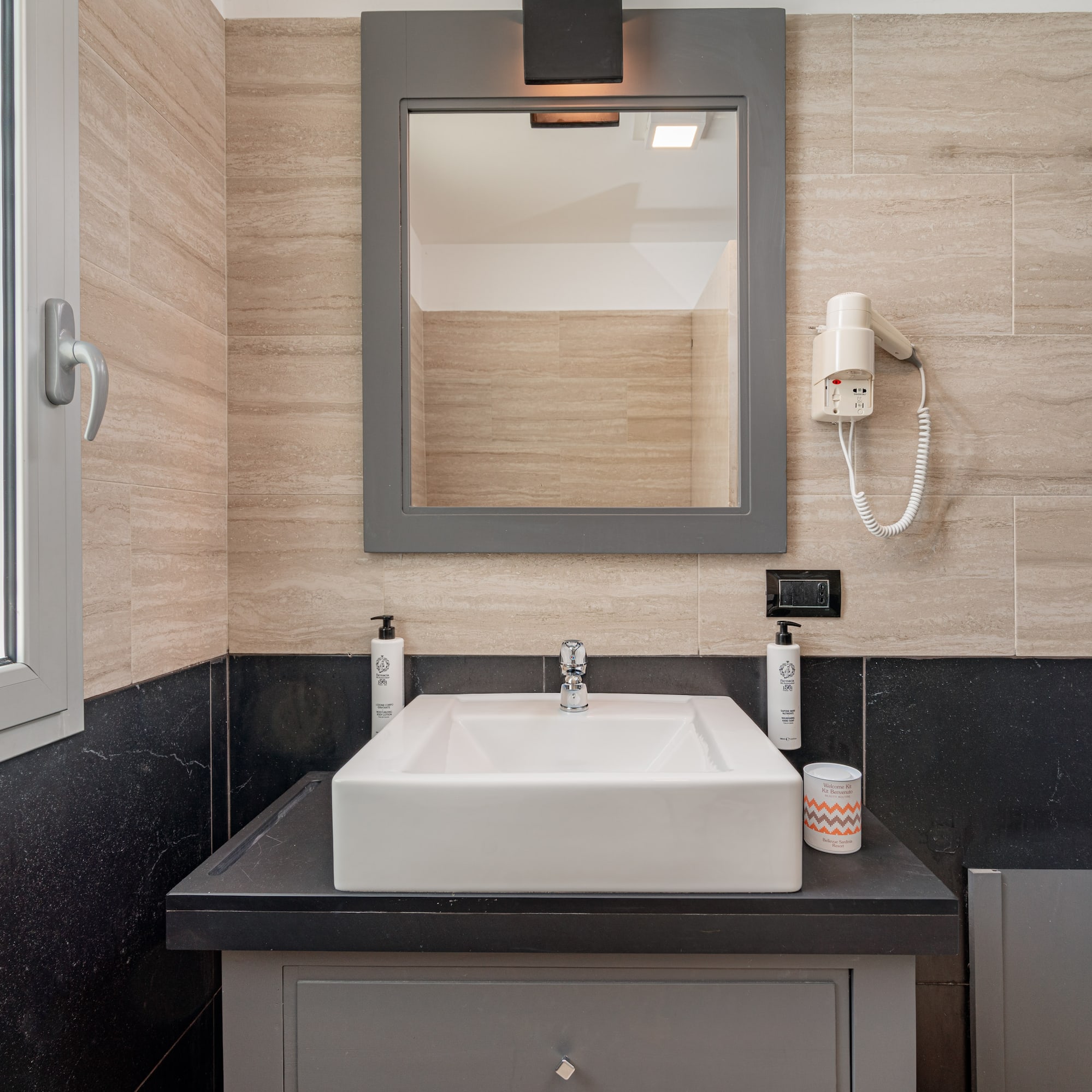 a bathroom with a mirror and sink