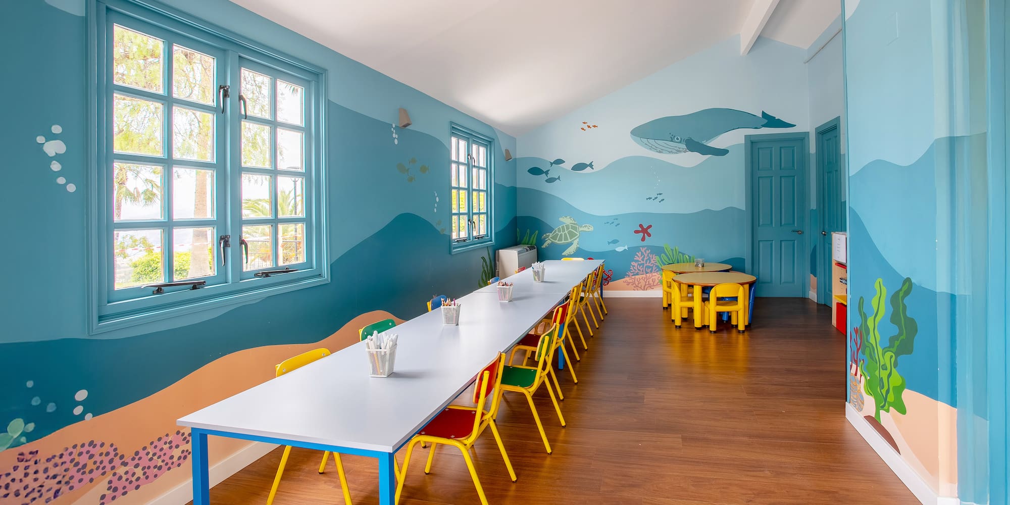 a room with a table and chairs