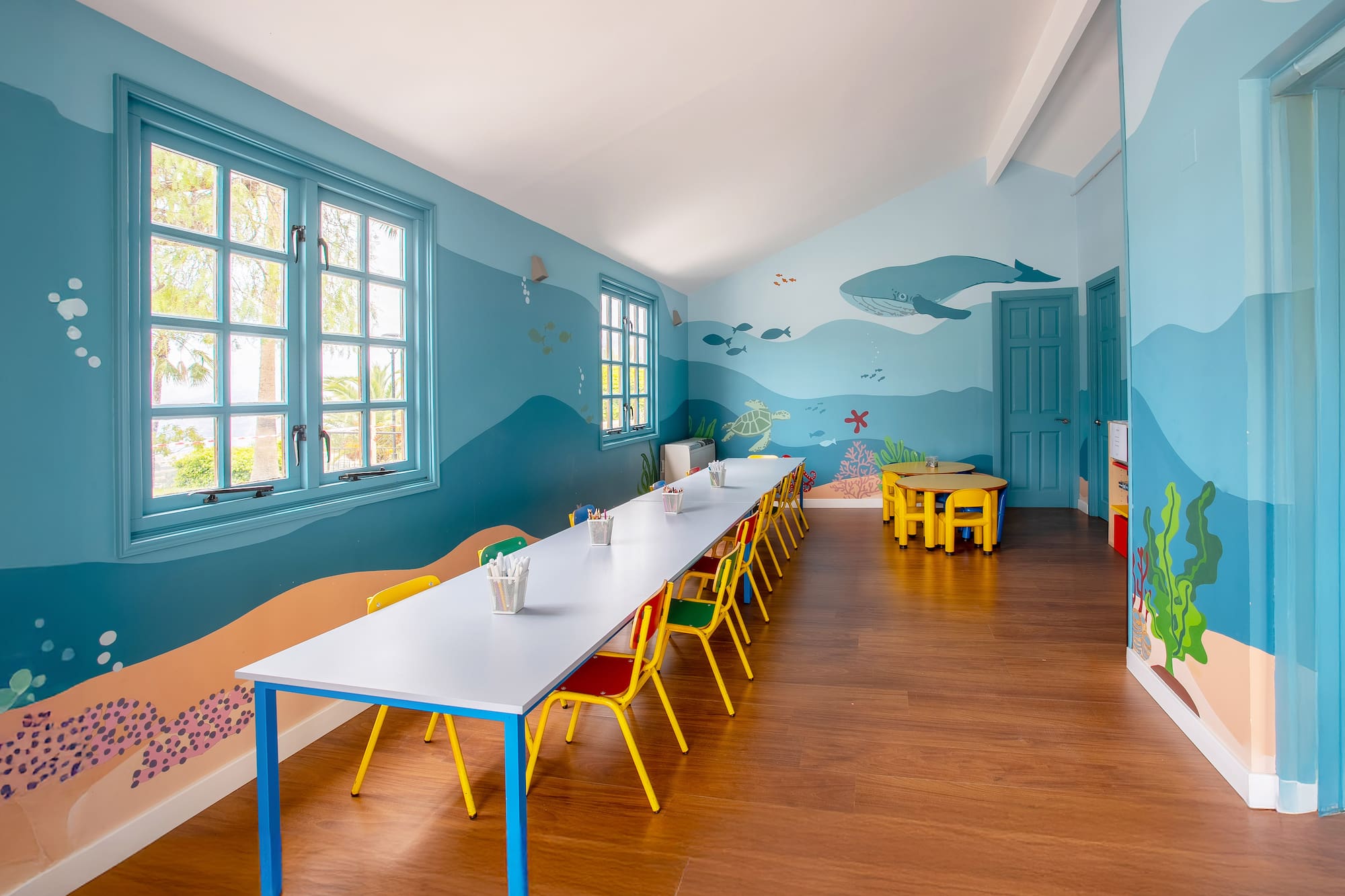 a room with a table and chairs