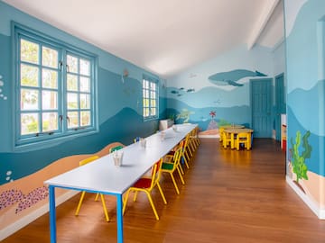 a room with a table and chairs