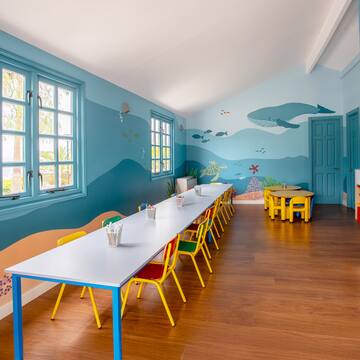 a room with a table and chairs