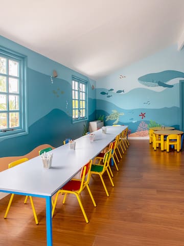 a room with a table and chairs