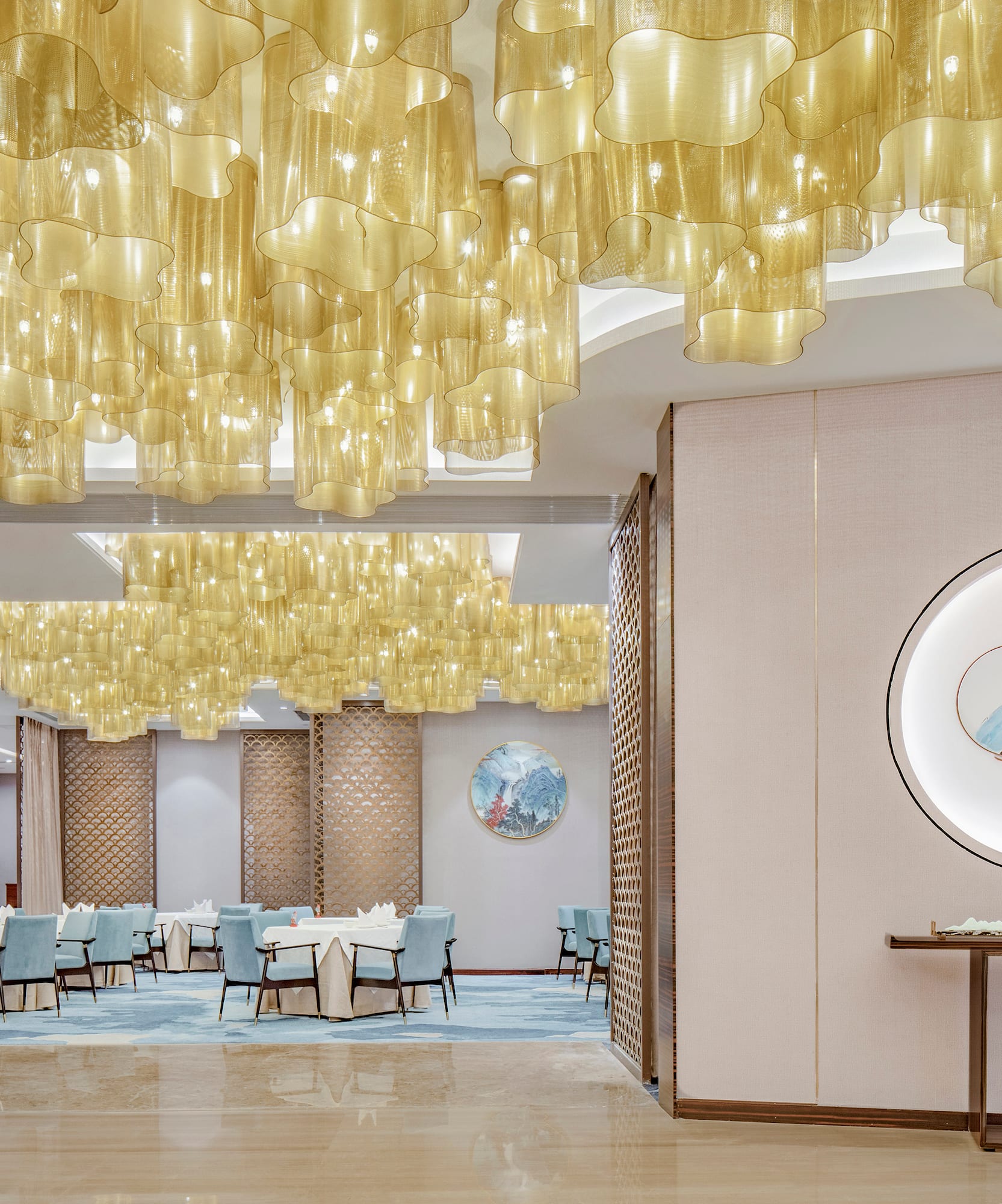 a room with a table and chairs and a painting on the ceiling