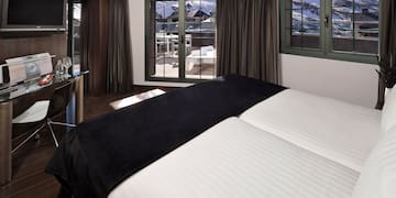 a room with a bed and a desk