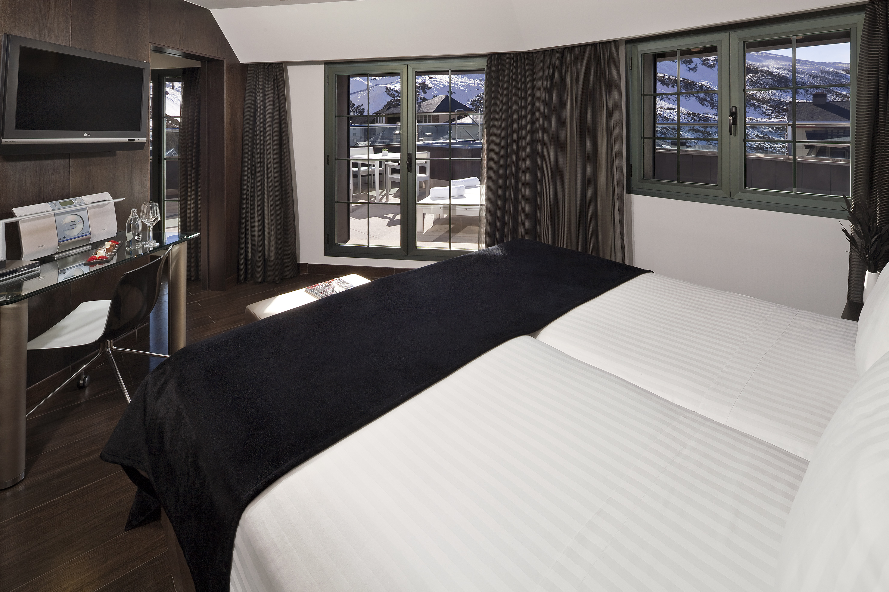 a room with a bed and a desk