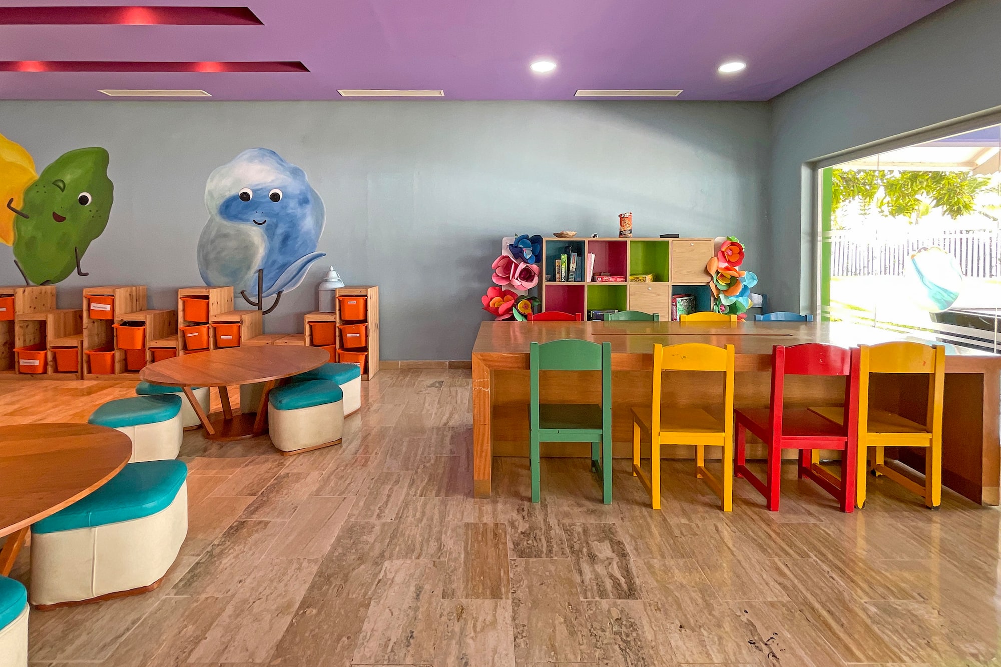 a room with colorful chairs and tables