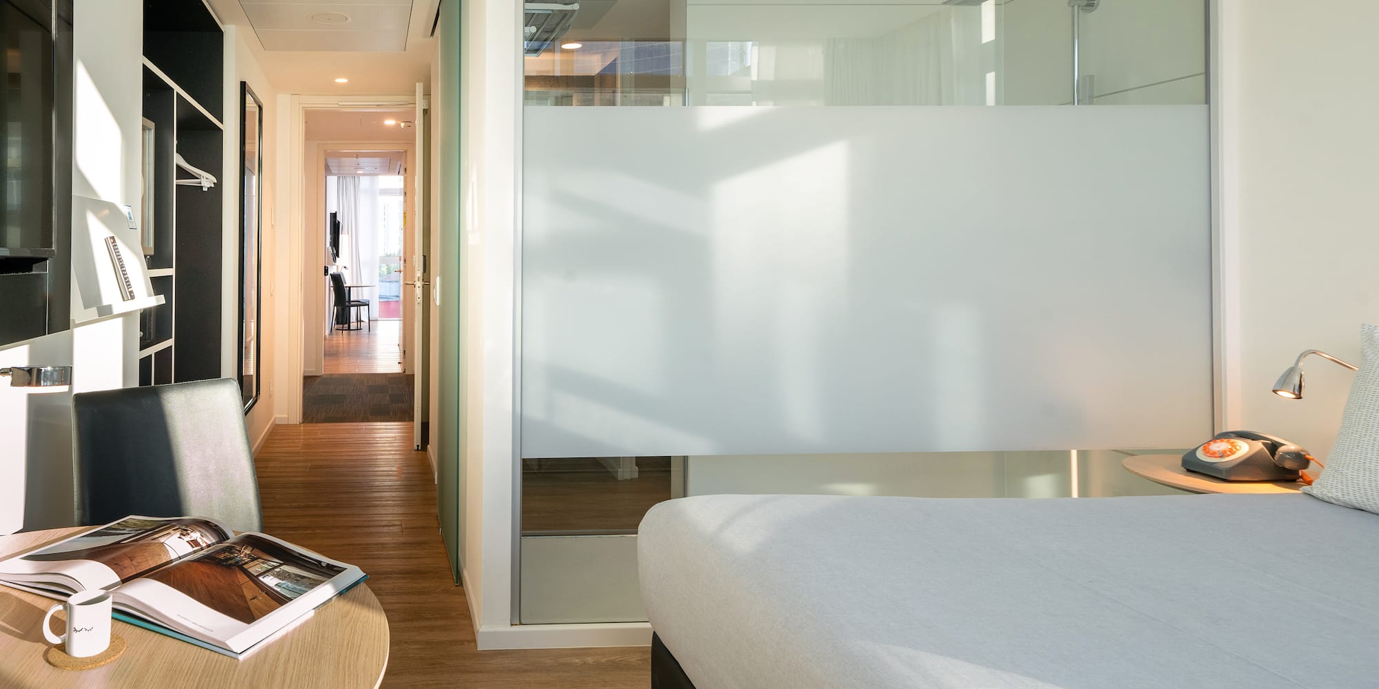 a room with a bed and a desk