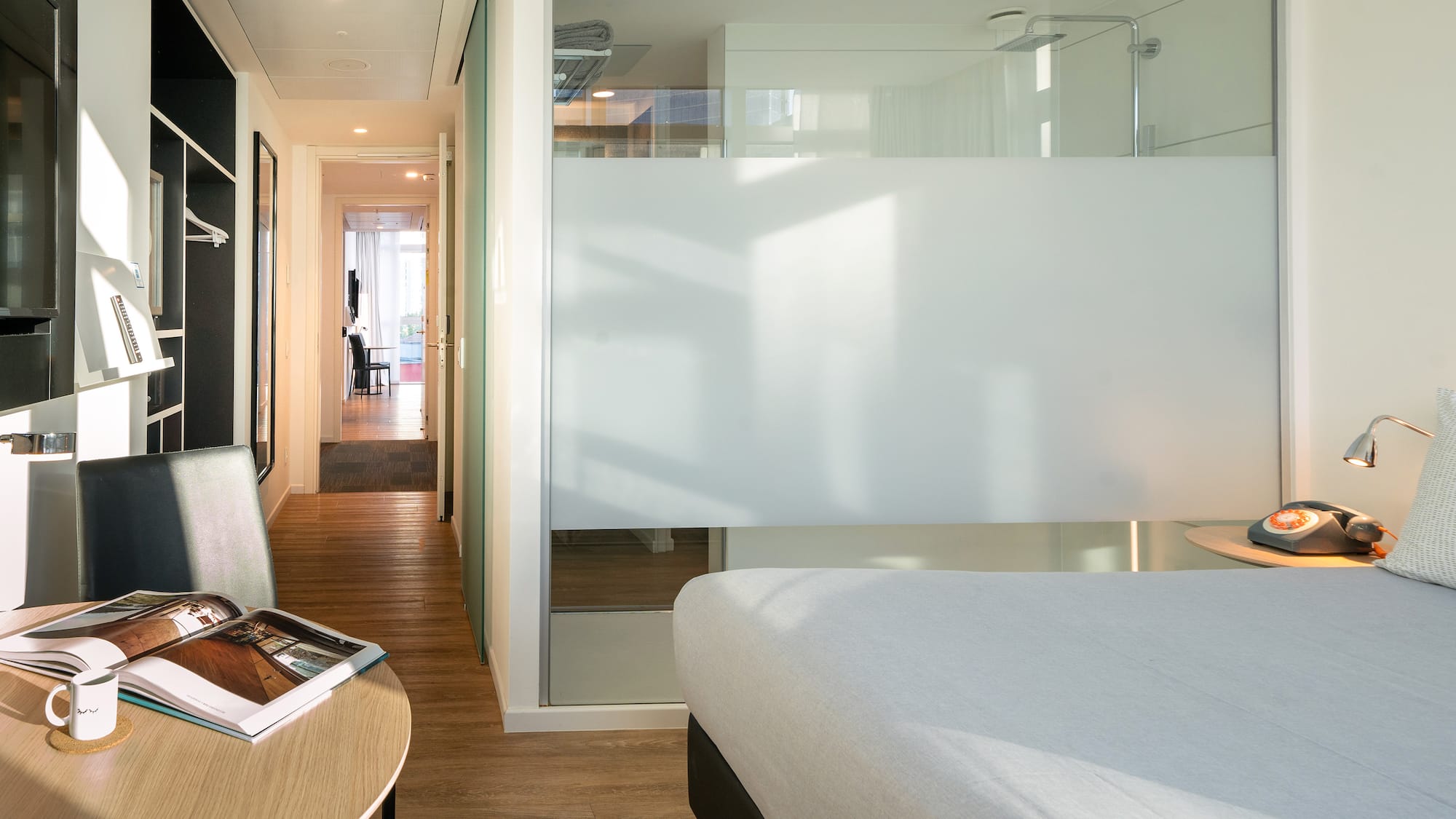 a room with a bed and a desk