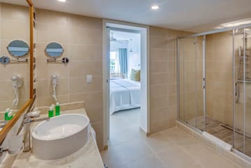 a bathroom with a shower and sink