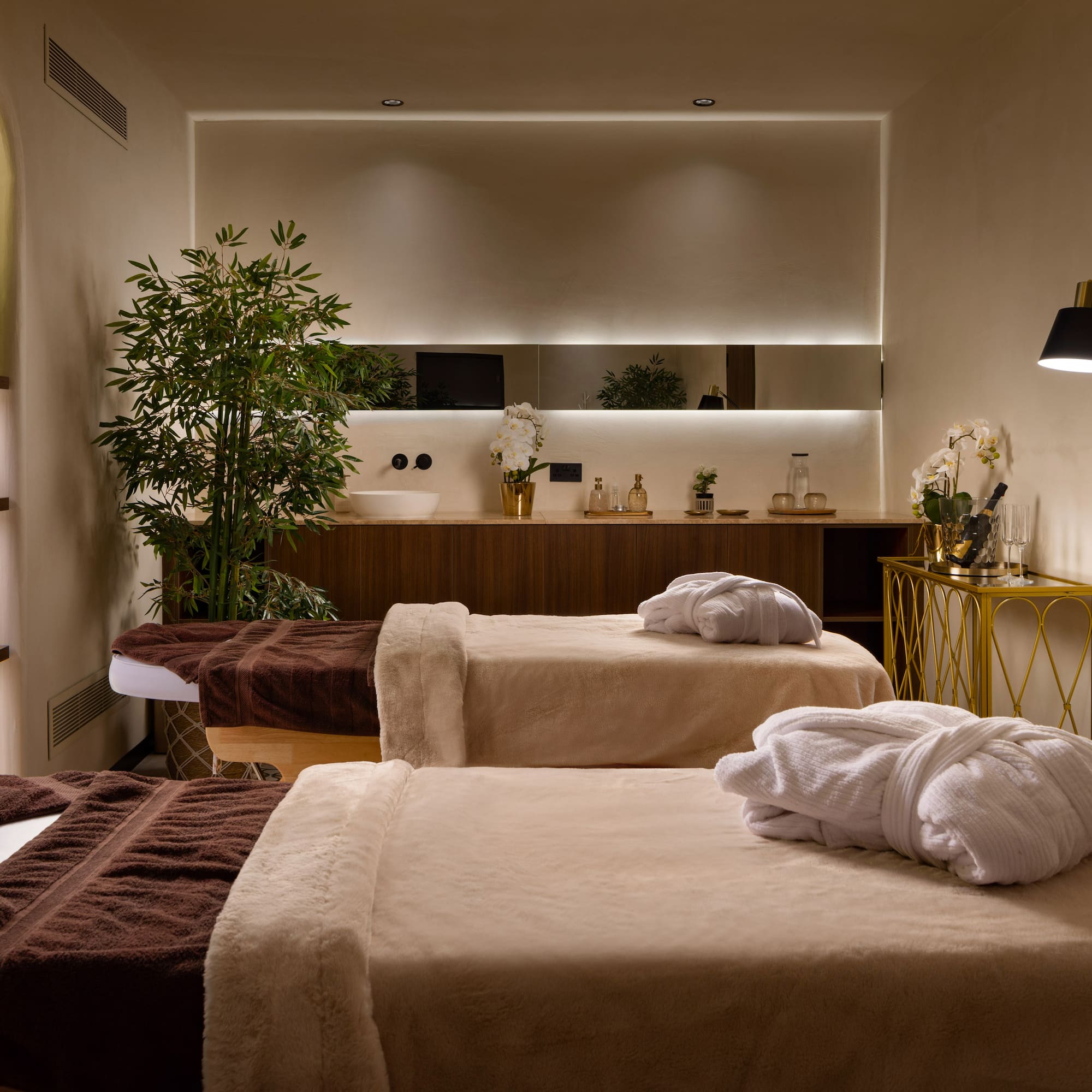 a room with beds and towels