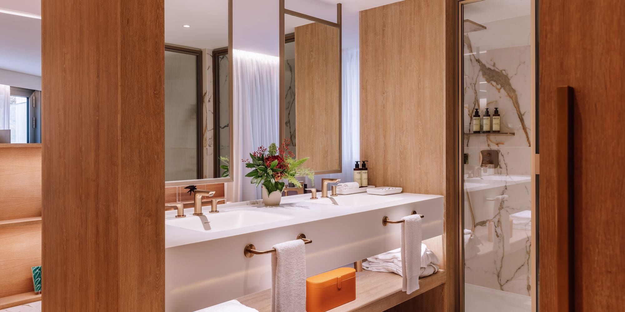 a bathroom with a marble floor and marble countertop