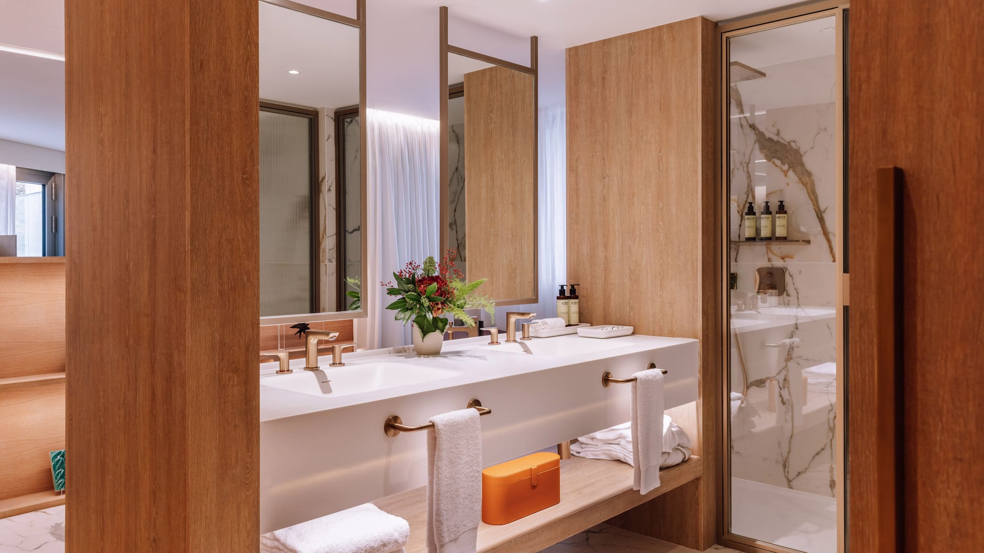 a bathroom with a marble floor and marble countertop