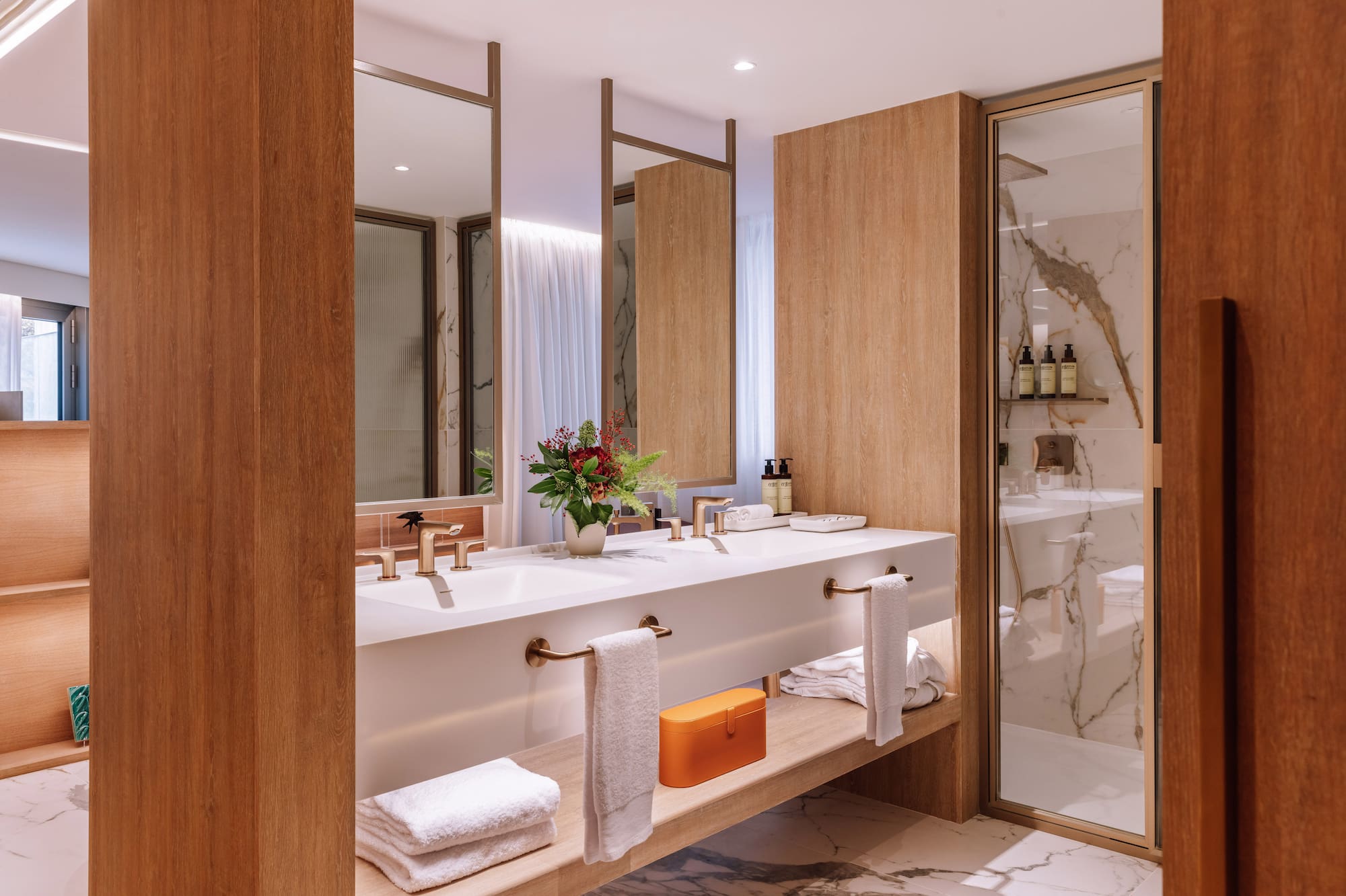 a bathroom with a marble floor and marble countertop