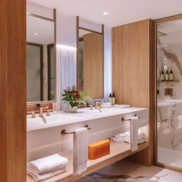 a bathroom with a marble floor and marble countertop