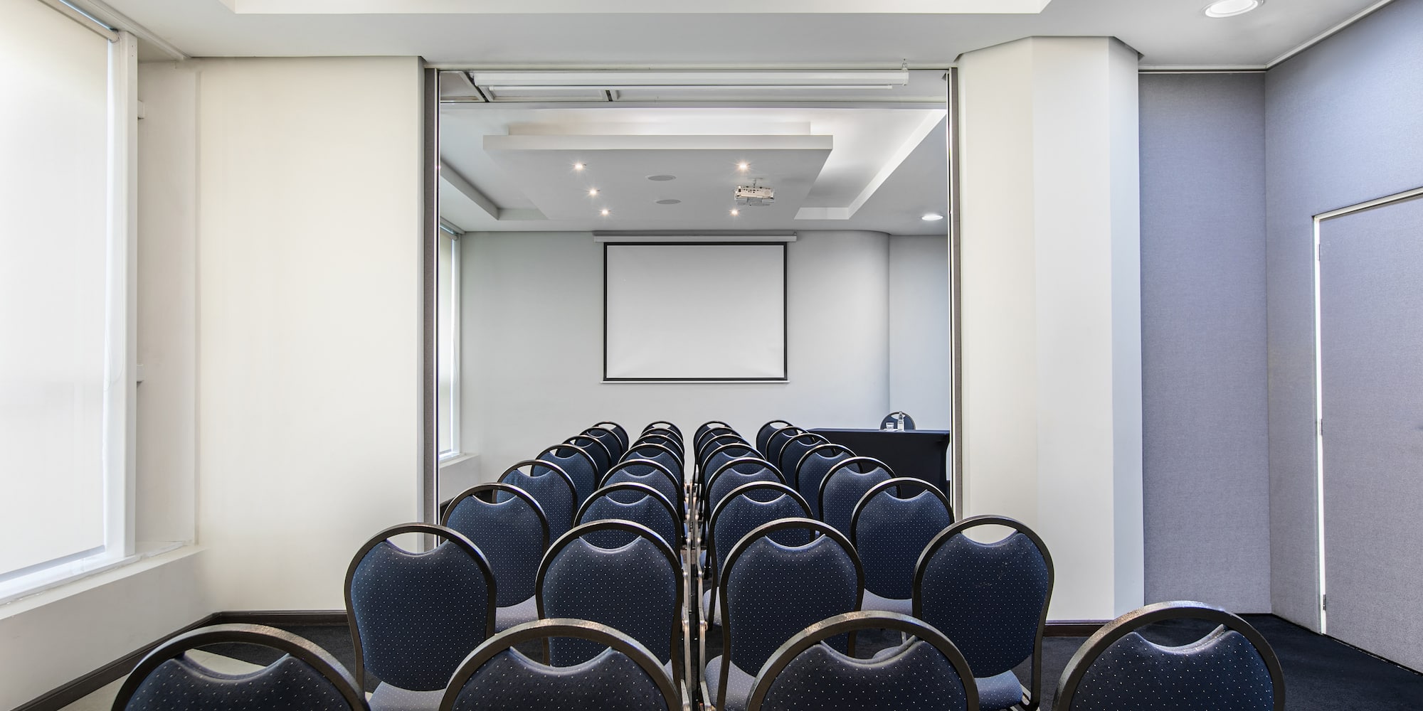 a room with rows of chairs