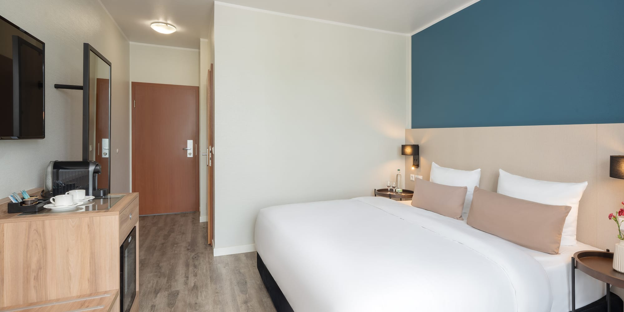 a bedroom with a bed and a tv