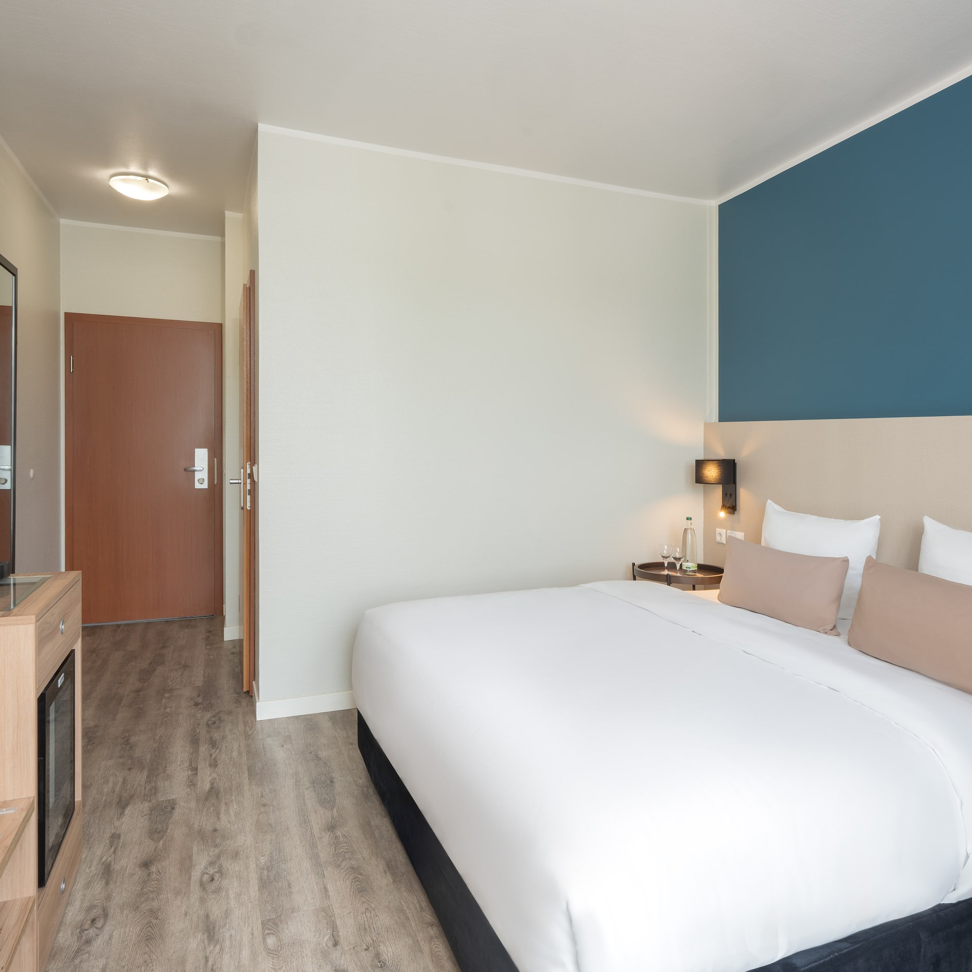 a bedroom with a bed and a tv