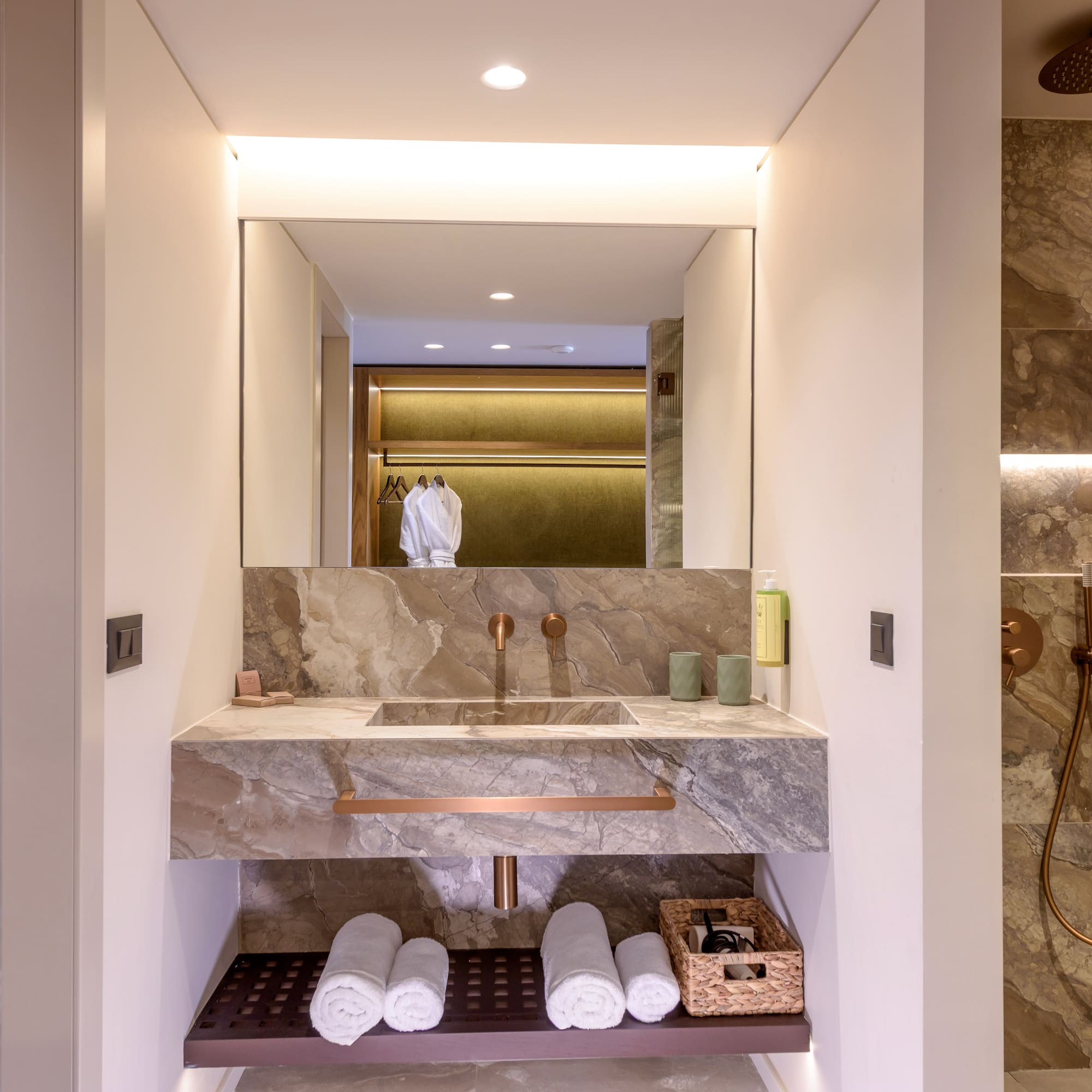 a bathroom with a sink and a shower.