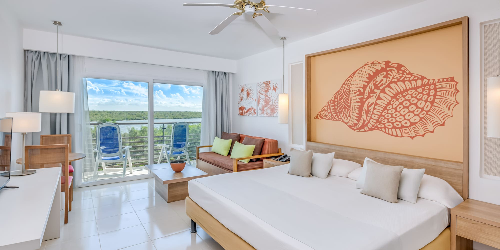 a room with a bed and a ceiling fan