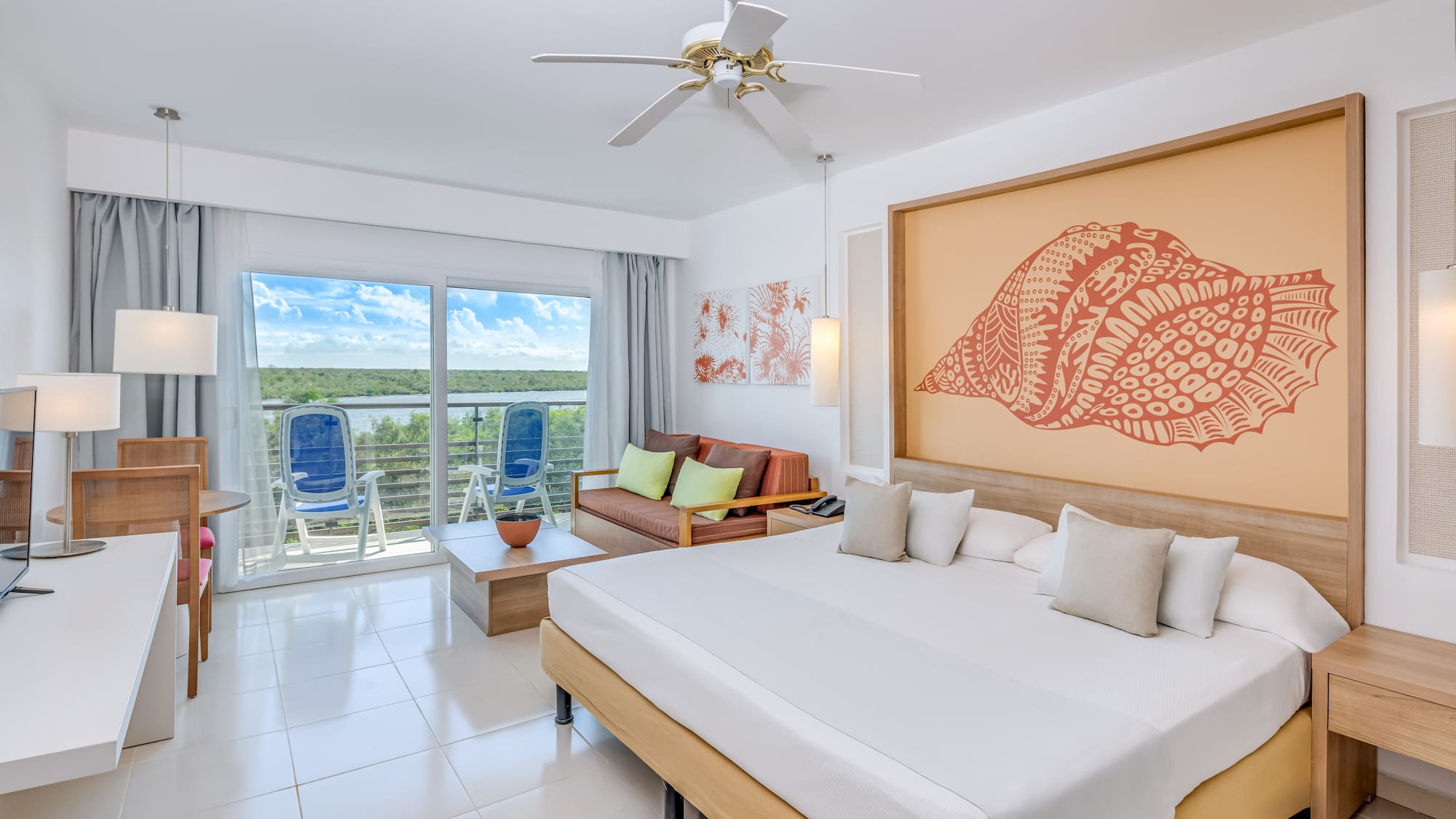 a room with a bed and a ceiling fan