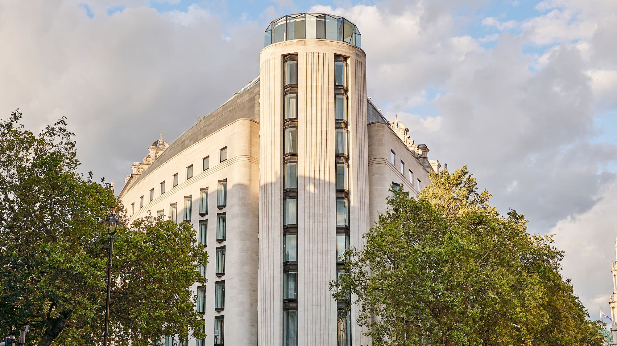 a group of people walking around a building