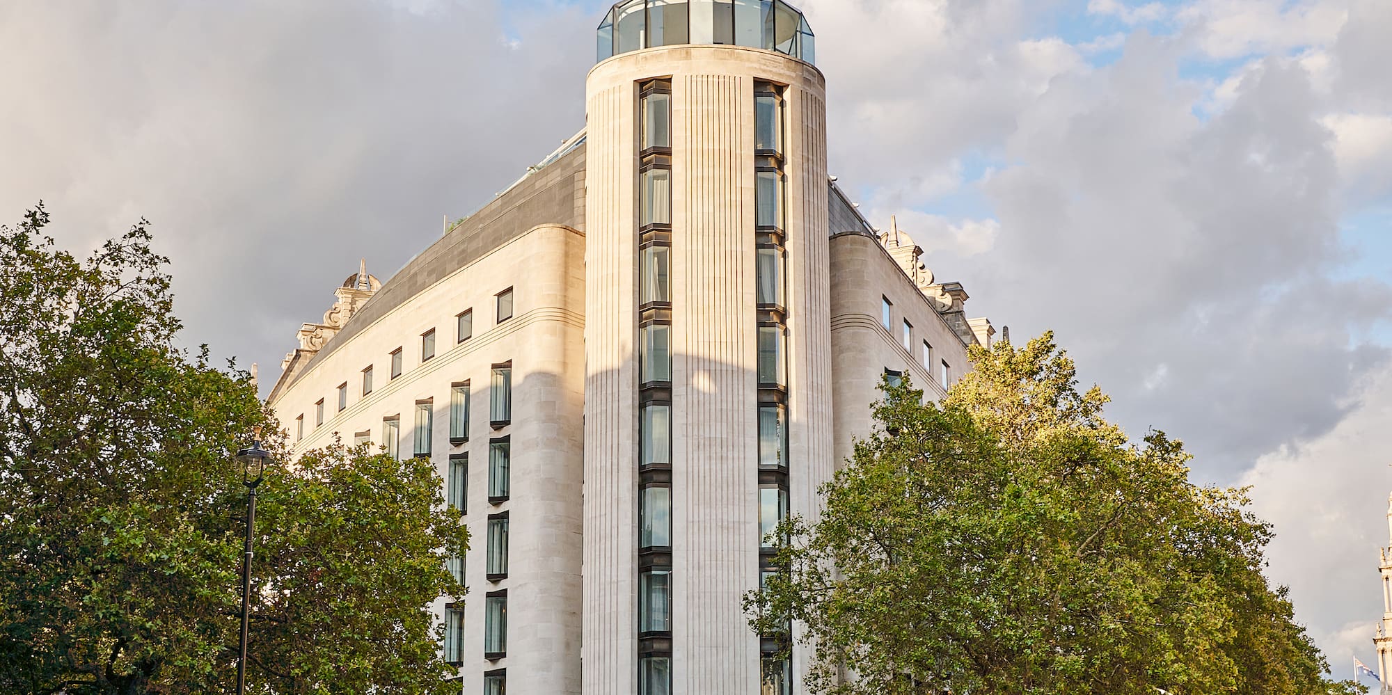 a group of people walking around a building
