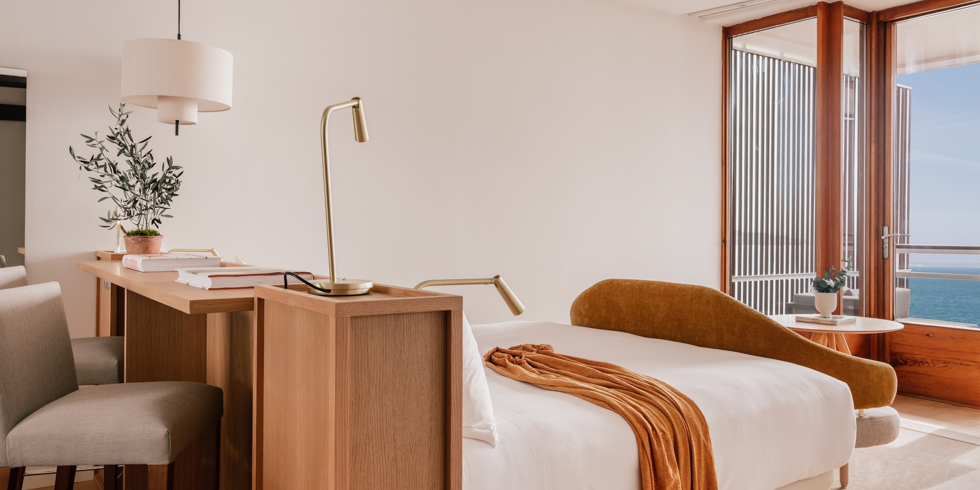 a room with a bed and a desk