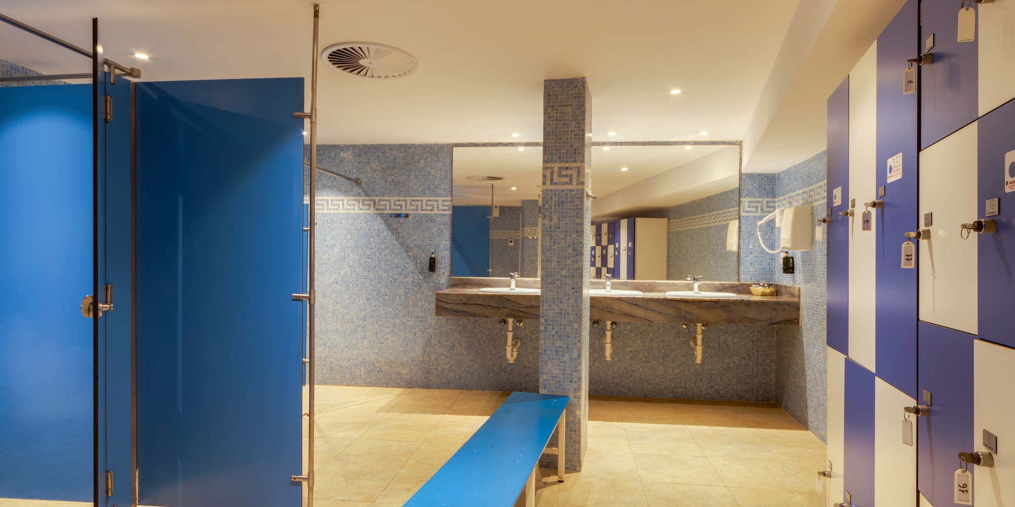 a bathroom with blue doors and blue walls