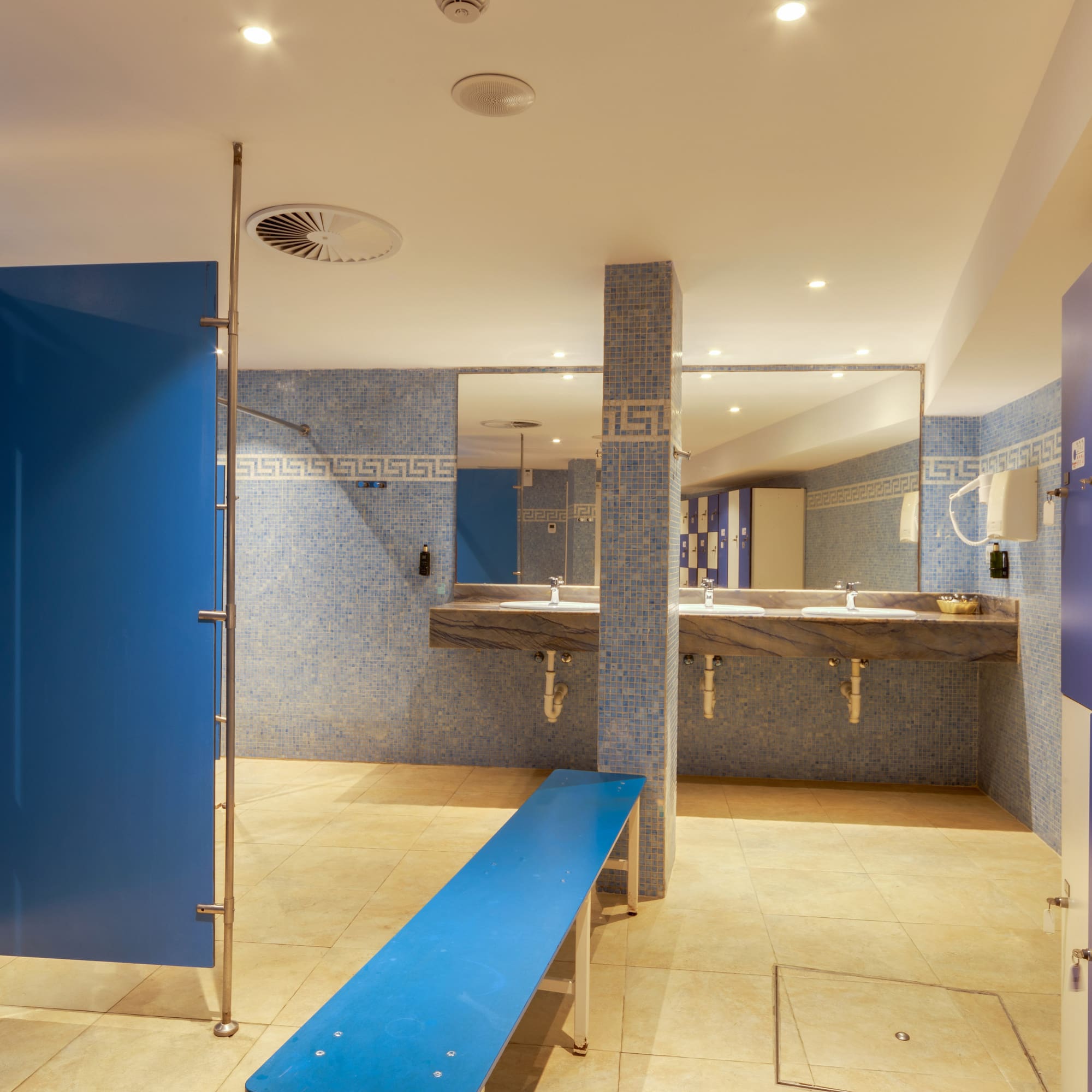 a bathroom with blue doors and blue walls