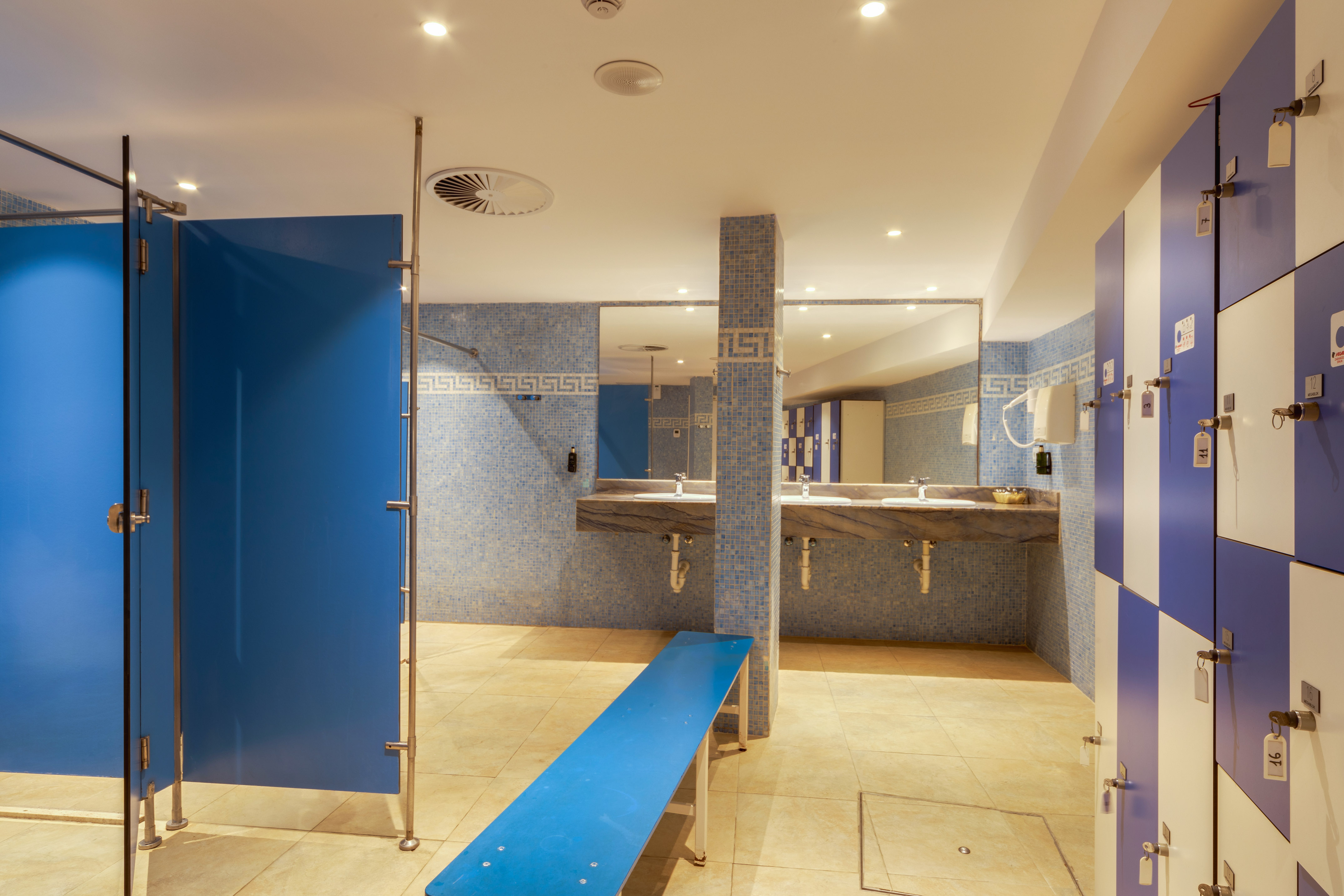 a bathroom with blue doors and blue walls