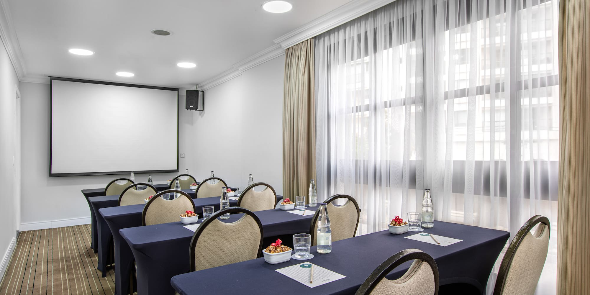 a room with tables and chairs