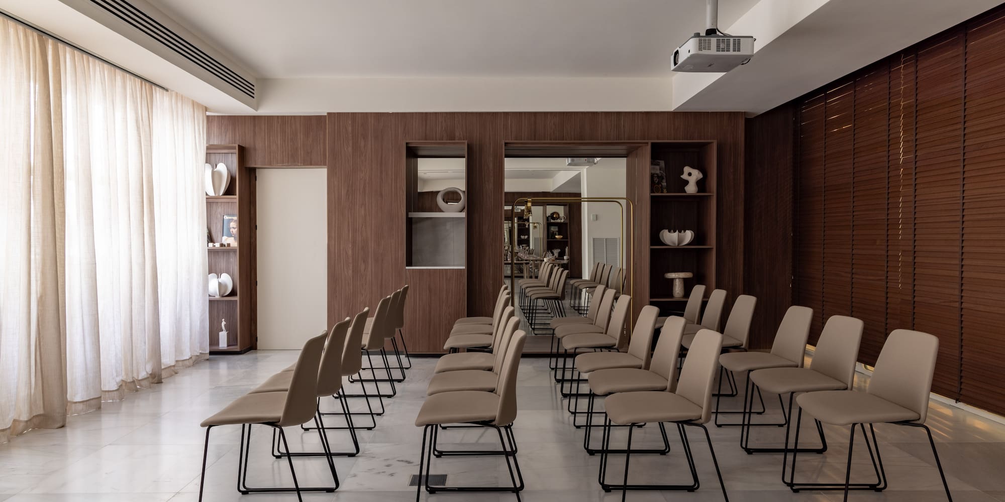 a room with chairs and a large window