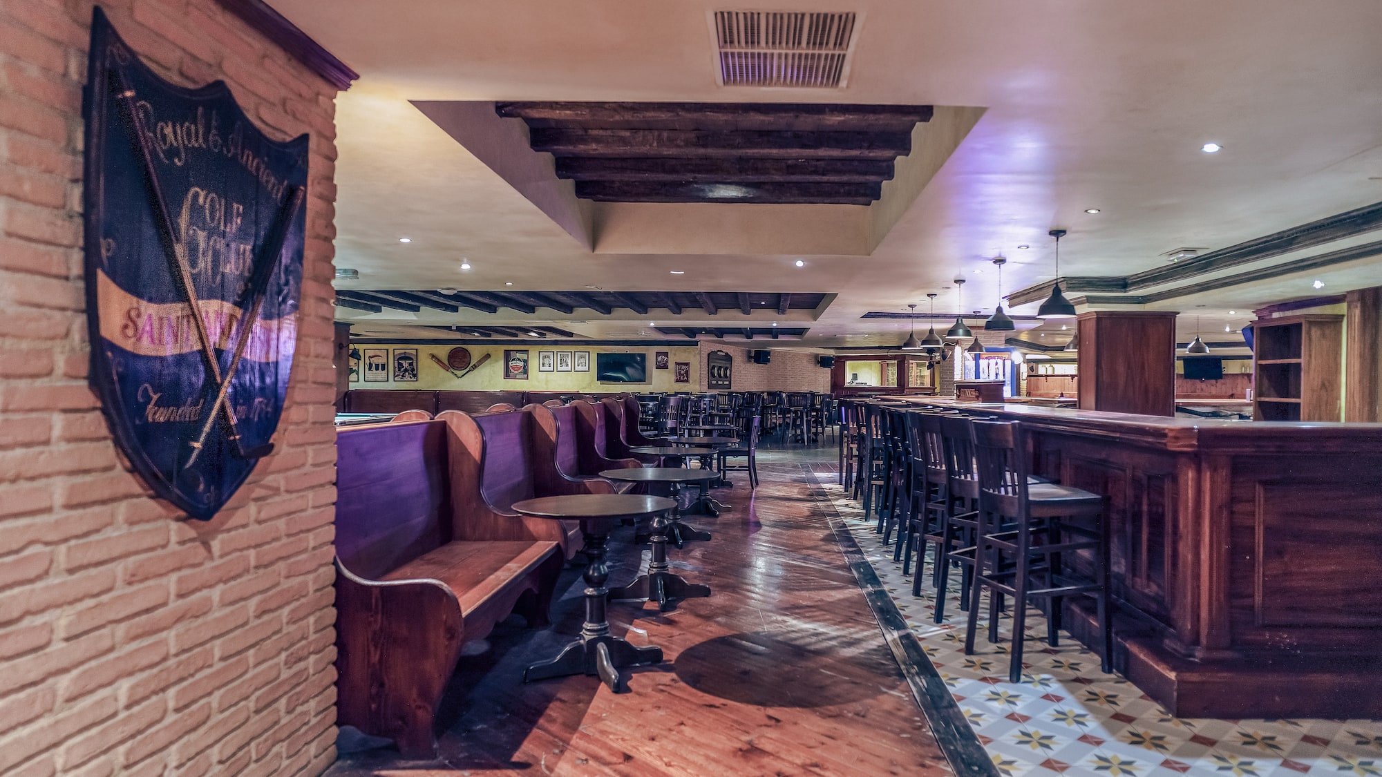 a room with benches and tables