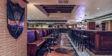 a room with benches and tables