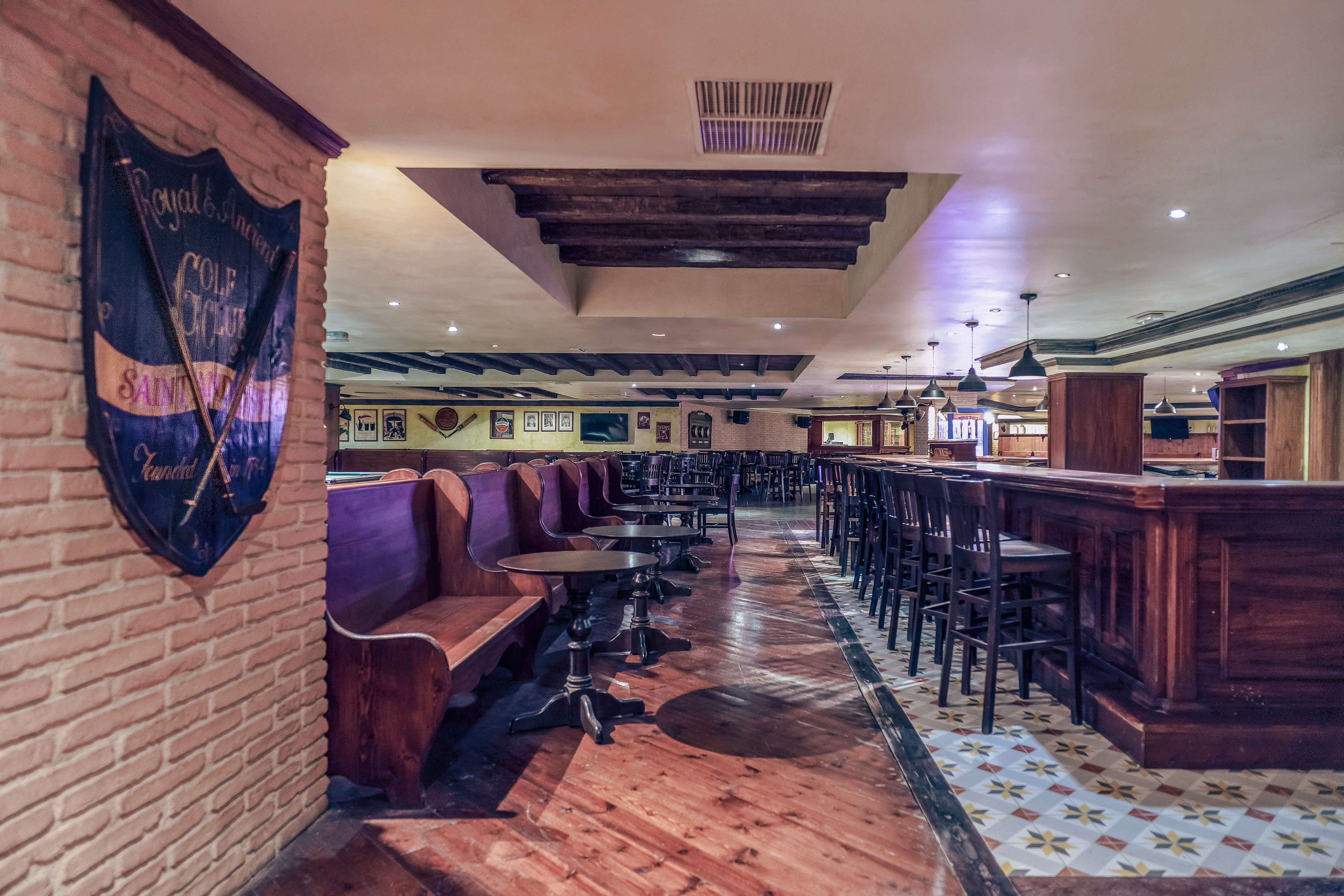 a room with benches and tables