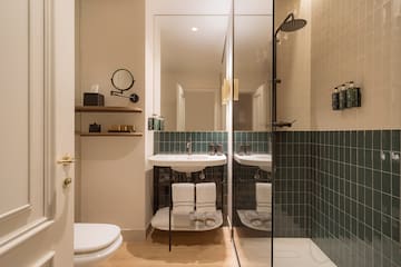 a bathroom with a shower and sink