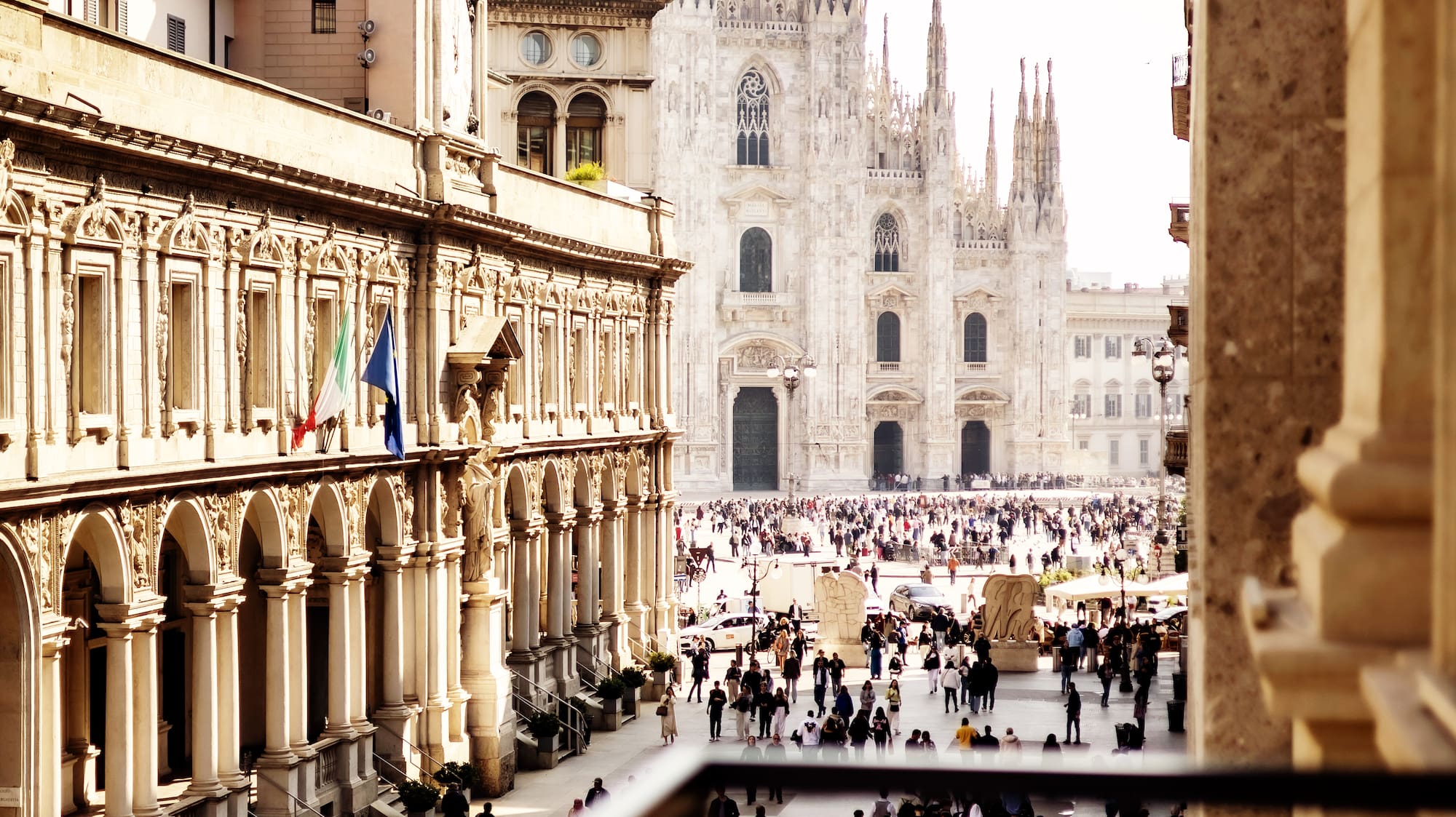 a group of people walking in a courtyard