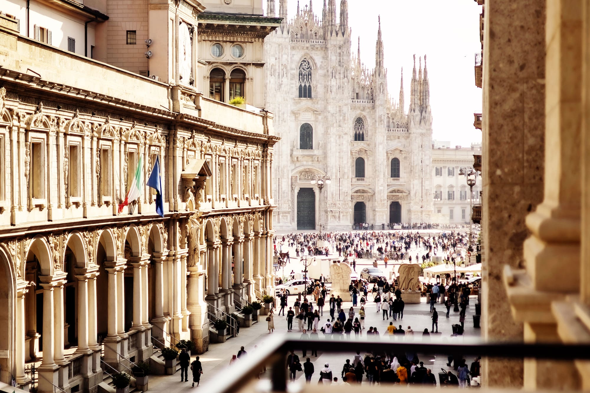 a group of people walking in a courtyard