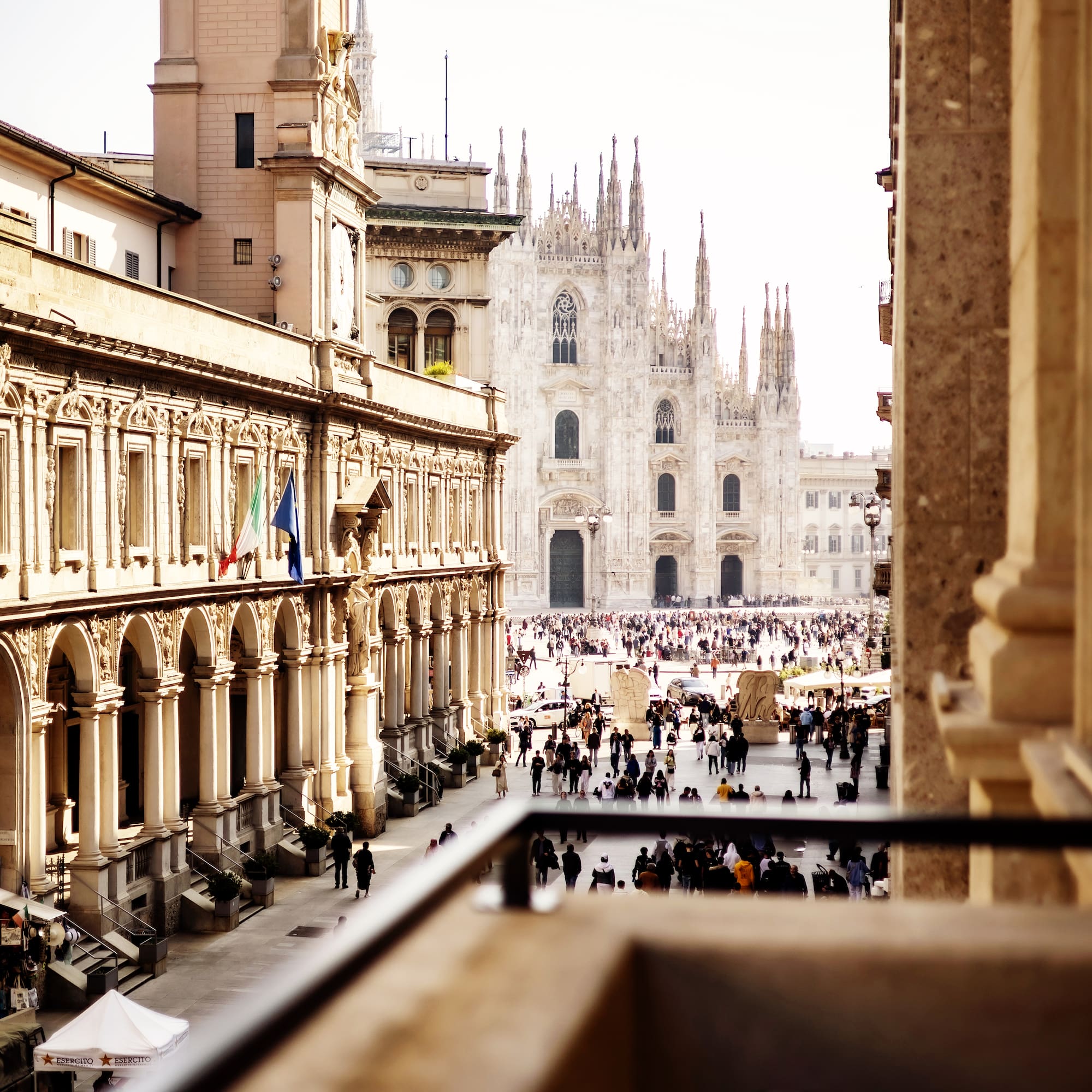 a group of people walking in a courtyard