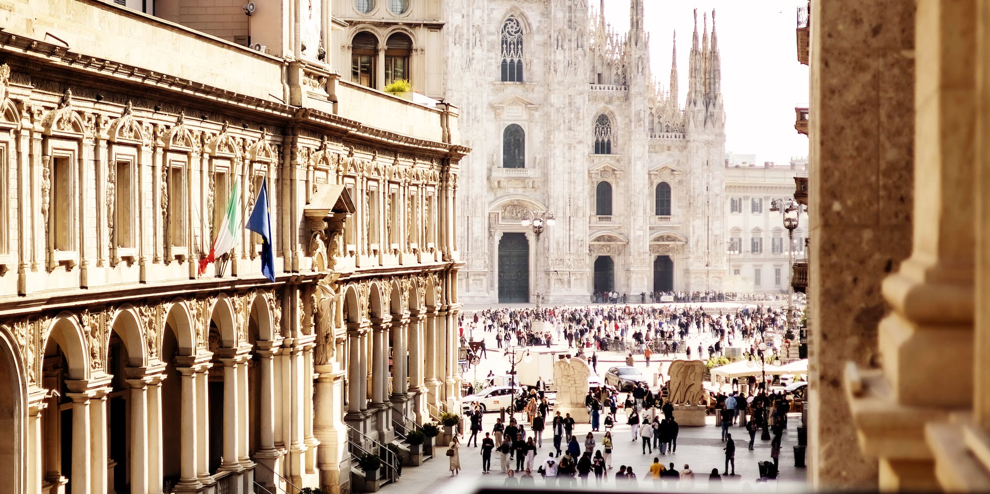 a group of people walking in a courtyard