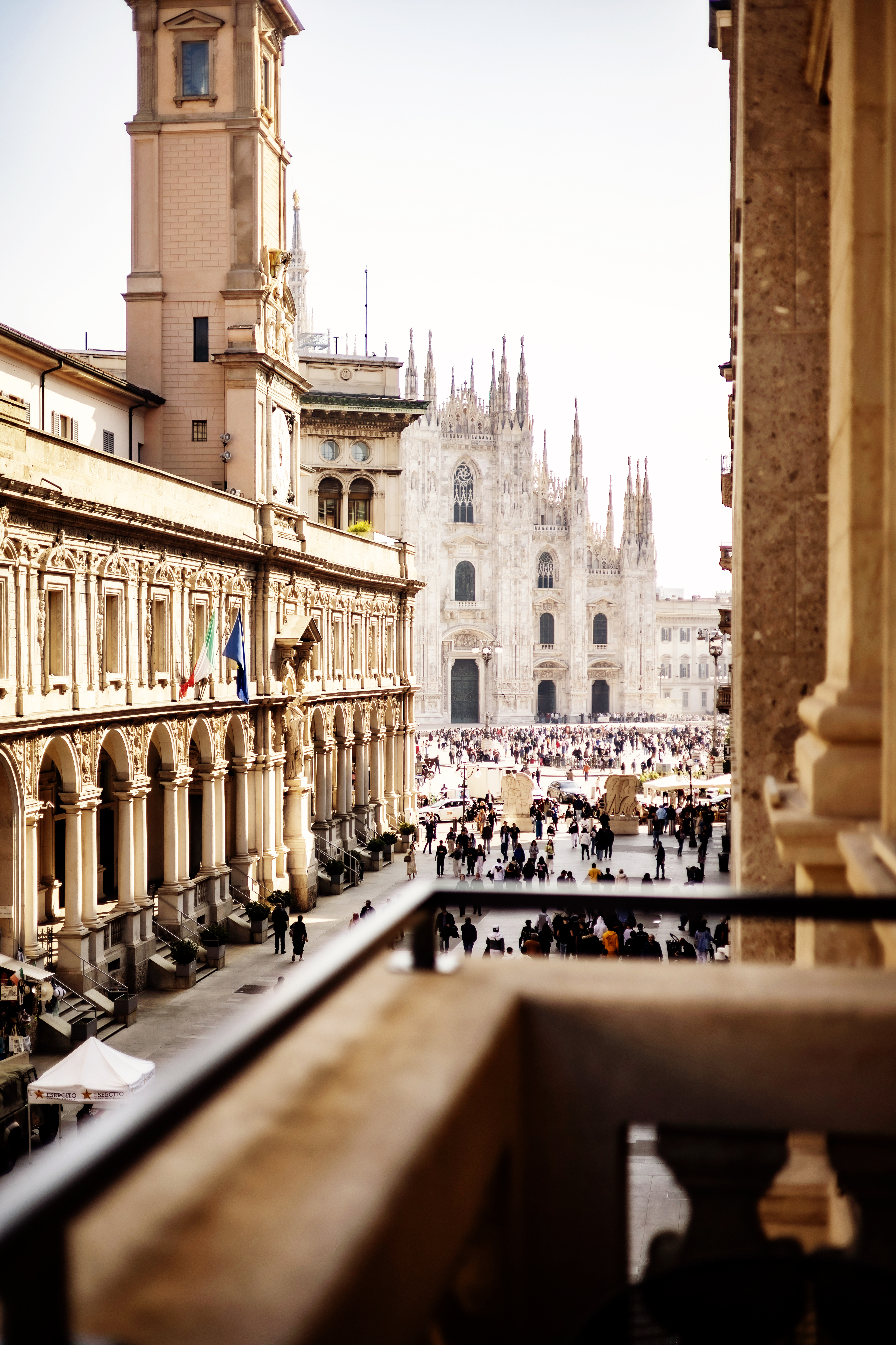 a group of people walking in a courtyard