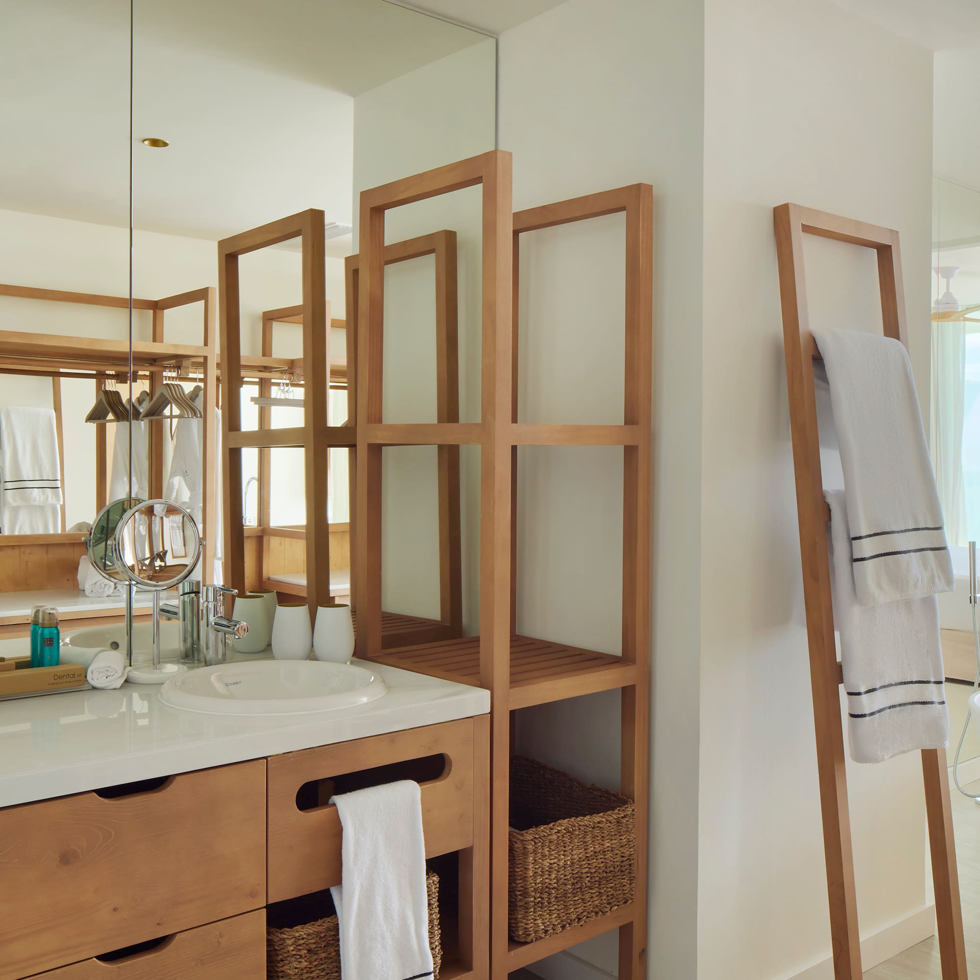 a bathroom with a mirror and a sink