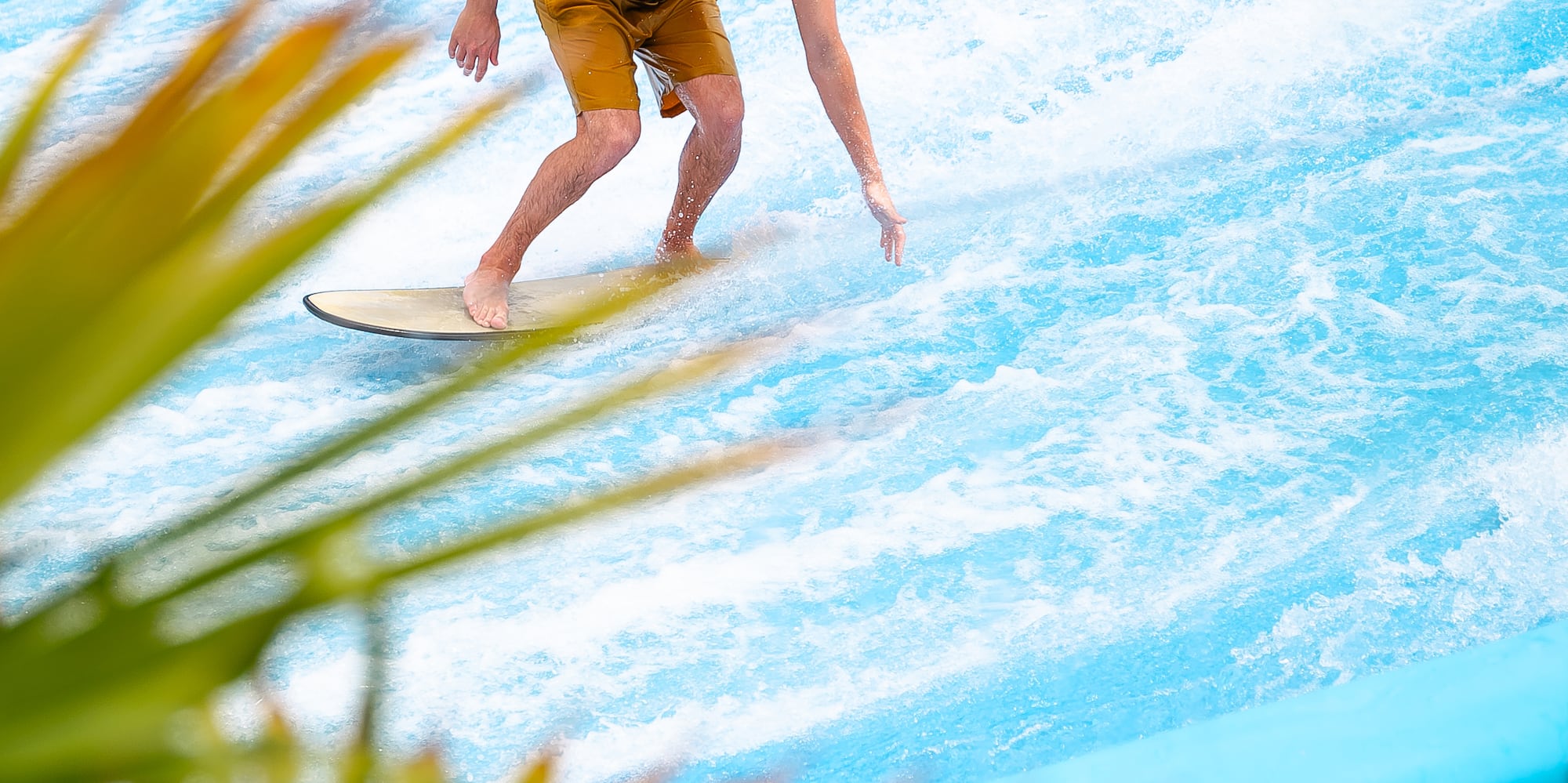 a man on a surfboard in a pool