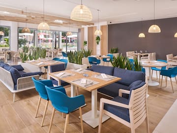 a restaurant with tables and chairs