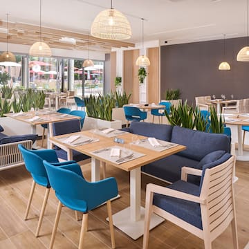 a restaurant with tables and chairs