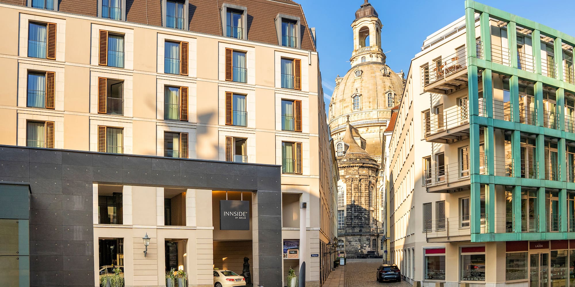 a street with bicycles parked in front of a building