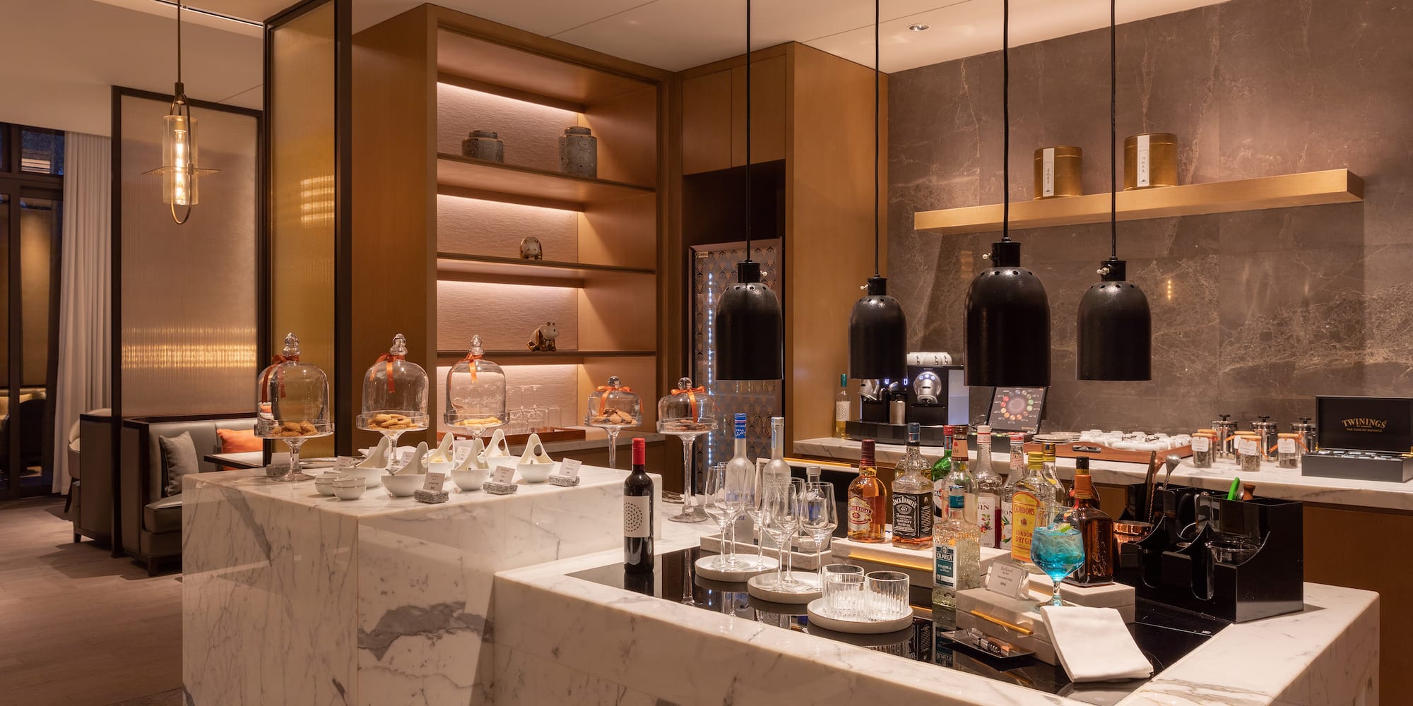 a bar with bottles and glasses on it