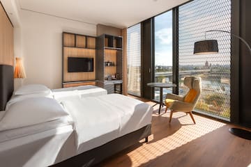 a room with a bed and a chair